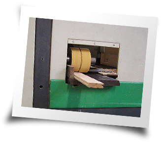 Photo of flooring being processed through our moulder